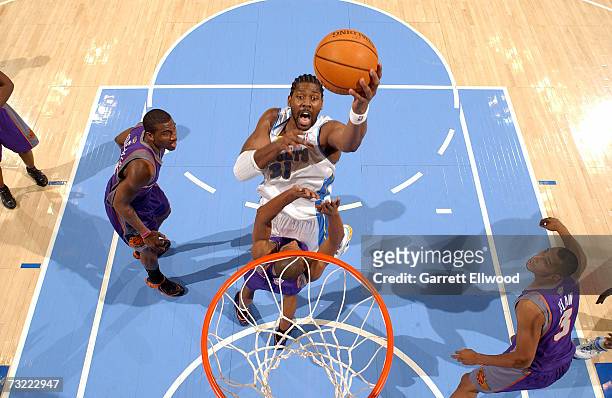 Nene of the Denver Nuggets goes to the basket against the Phoenix Suns on February 5, 2007 at the Pepsi Center in Denver, Colorado. NOTE TO USER:...