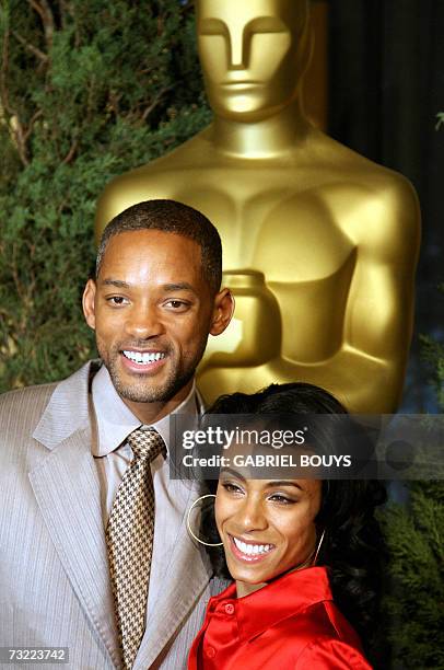 Beverly Hills, UNITED STATES: US actor Will Smith arrives with his wife actress Jada Pinkett Smith at the 79th annual Academy Awards Nominees...