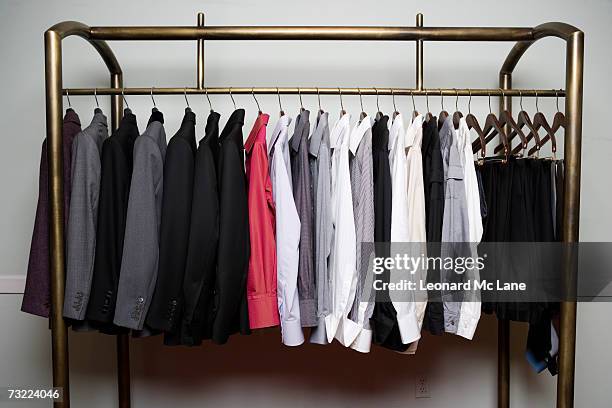 clothes on rack, close-up - barra para colgar la ropa fotografías e imágenes de stock