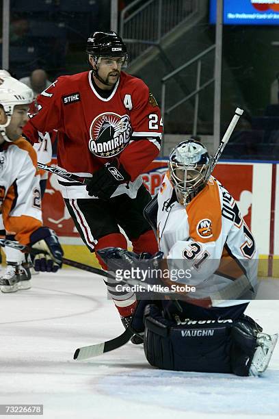 Goaltender Wade Dubielewicz of the Bridgeport Sound Tigers defends against Reed Low of the Norfolk Admirals at the Arena at Harbor Yard on November...