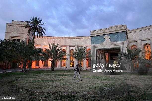 Marine Cpl. Chilet Paul from Miami, Florida, walks past the American Embassy February 5, 2007 in Baghdad, Iraq . The platoon of Marines from the...