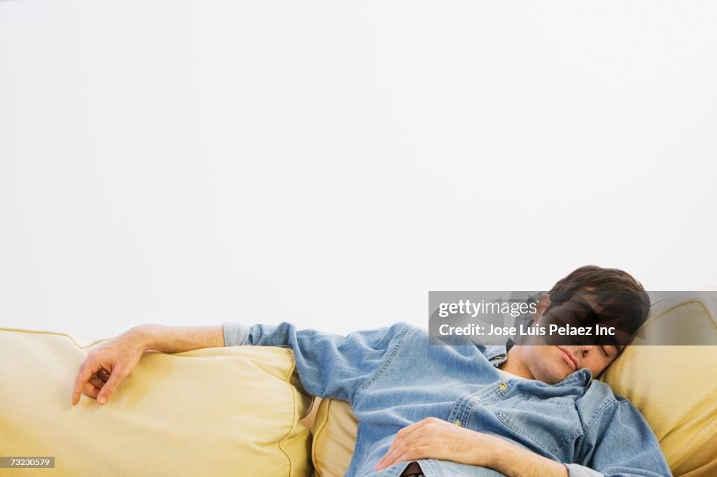 Man sleeping on sofa