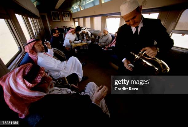 Prince Faisal bin Abdullah bin Mohammad Al Saud and a delegation of businessmen, princes and officials relax and drink coffee served by a Moroccan...