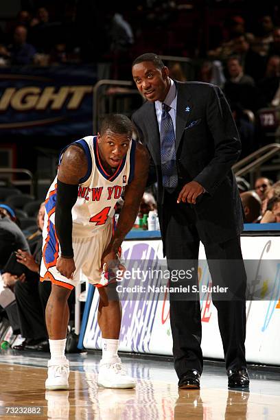 Nate Robinson of the New York Knicks talks with his head coach Isiah Thomas during the game against the Phoenix Suns on January 24, 2007 at Madison...