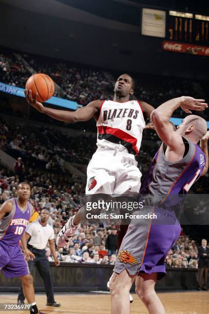 Martell Webster of the Portland Trail Blazers goes up for a shot past Pat Burke of the Phoenix Suns on February 6, 2007 at the Rose Garden Arena in...