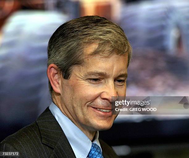File photo taken 23 August 2006 shows Chip Goodyear, chief executive officer for BHP Billiton, is all smiles arriving for a preliminary results...