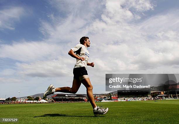 Luke Hodge of the Hawthorn Hawks takes part in a sprinting drill in training at the North Hobart Oval during the clubs AFL Community Camp on February...