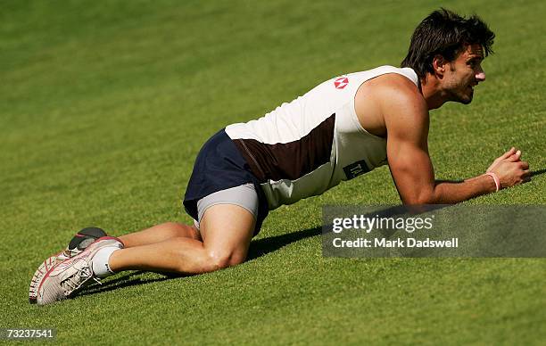 Ben Dixon of the Hawthorn Hawks warms up for training at the North Hobart Oval during the clubs AFL Community Camp on February 7, 2007 in Hobart,...