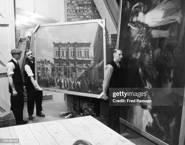 Painting is taken out of storage for routine inspection at an underground facility at Manod Quarry, north Wales, where paintings from the National...