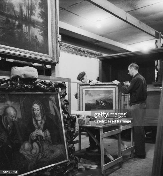 Picture frame being repaired in a subterranean chamber at Manod Quarry, north Wales, where paintings from the National Gallery have been moved for...