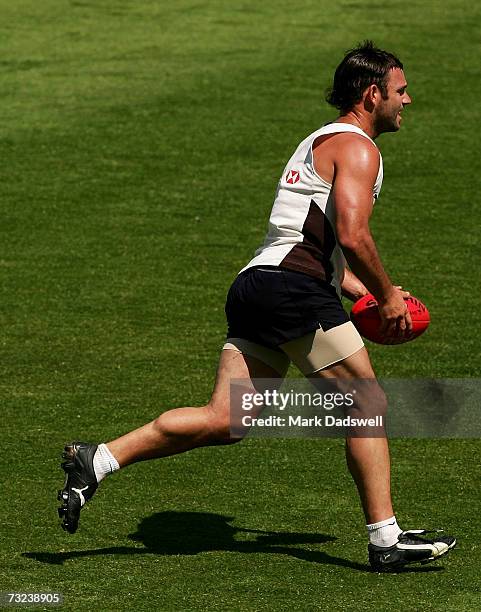 Brent Guerra of the Hawks looks to deliver the ball during the Hawthorn Hawks AFL Community Camp at the North Hobart Oval on February 7, 2007 in...