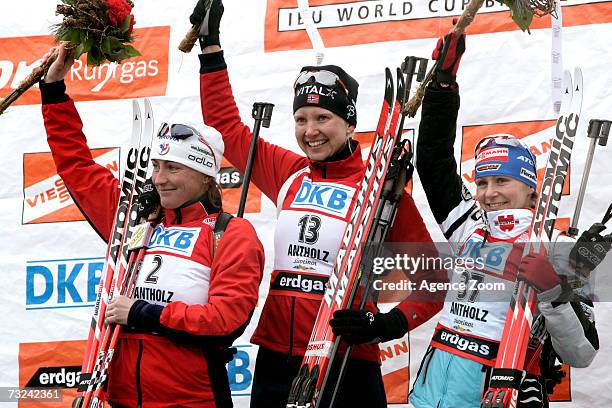 Florence Baverel-Robert of France, Linda Grubben of Norway and Martina Glagow of Germany celebrate winning their medals for the Women's 15 km...