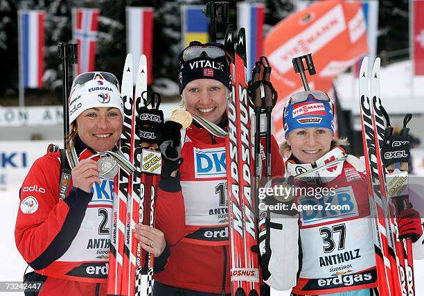Florence Baverel-Robert of France, Linda Grubben of Norway and Martina Glagow of Germany celebrate winning their medals for the Women's 15 km...