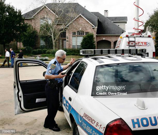 Police officers stand by at the home of astronaut Lisa Marie Nowak on February 7, 2006 in Houston, Texas. Nowak has been charged with attempted...