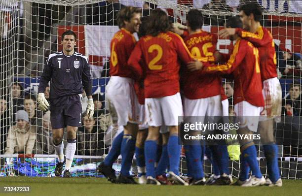 Manchester, UNITED KINGDOM: Spanish players celebrate after Andres Iniesta scored past England goalkeeper Ben Foster during their international...