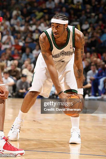 Bracey Wright of the Minnesota Timberwolves holds the ball against the Detroit Pistons during the game at Target Center on January 19, 2007 in...