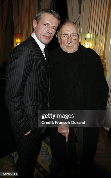 Lambert Wilson and his father pase after he has been awared by minister Renaud Donnedieu de Vabres, as knights in the Order of Arts and Letters on...