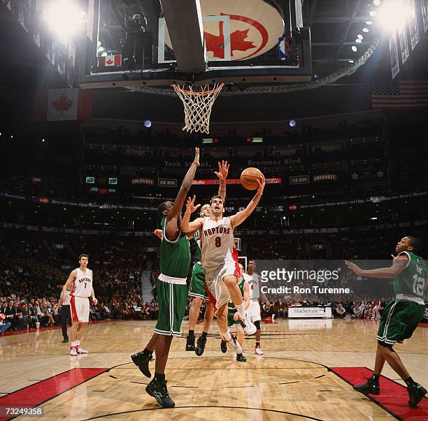 Jose Calderon of the Toronto Raptors drives to the basket for a layup against the Boston Celtics at Air Canada Centre on January 26, 2007 in Toronto,...