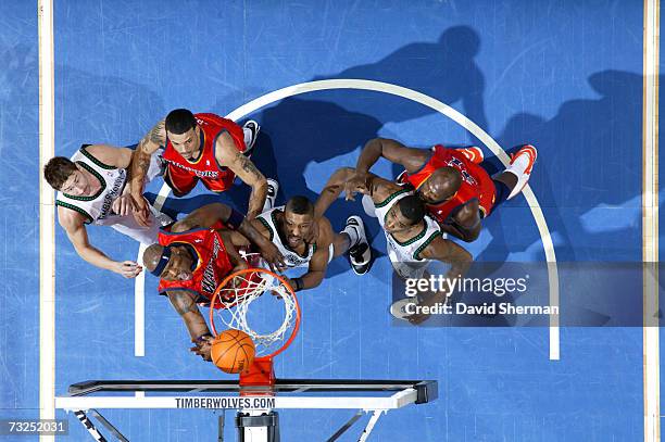 Al Harrington of the Golden State Warriors scores two against Craig Smith of the Minnesota Timberwolves on February 7, 2007 at the Target Center in...