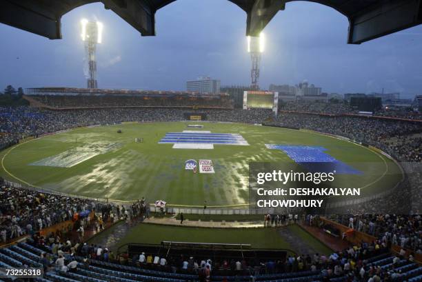 Spectators linger in the stands at Eden Gardens Stadium in Kolkata, 08 February 2007, as the One Day International cricket match between India and...