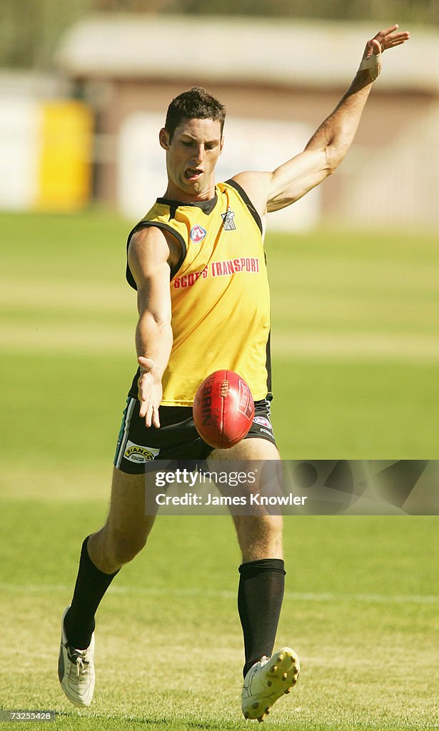 Ryan Willits of the Power kicks whilst on the Port Adelaide Power AFL
