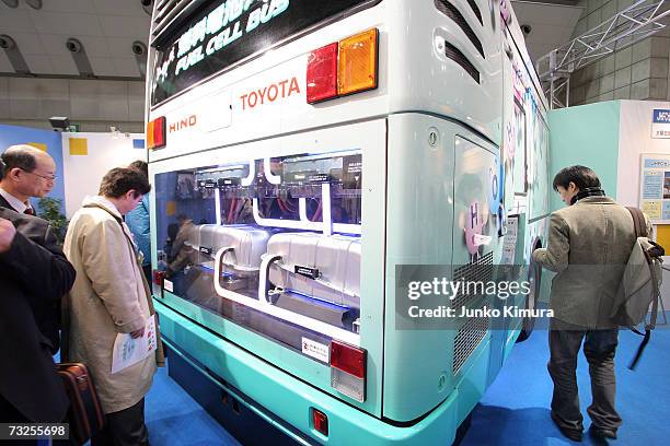 Visitors review a hydrogen powered coach engine at the International Hydrogen and Fuel Cell Expo, the world's largest fuel cell & hydrogen industry...