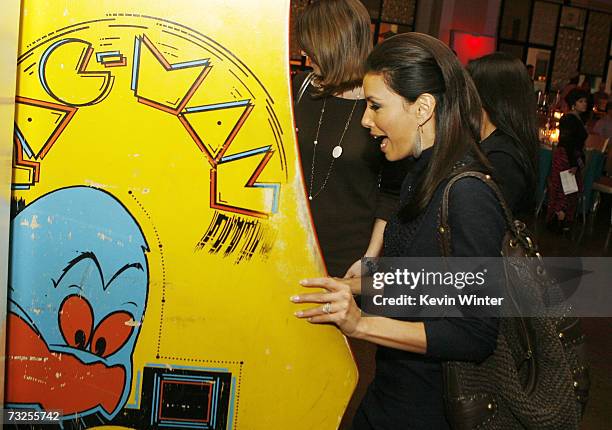 Actress Eva Longoria plays Pac-Man at the afterparty for the premiere of Warner Bros. Picture's "Music and Lyrics" at the Annix on February 7, 2007...