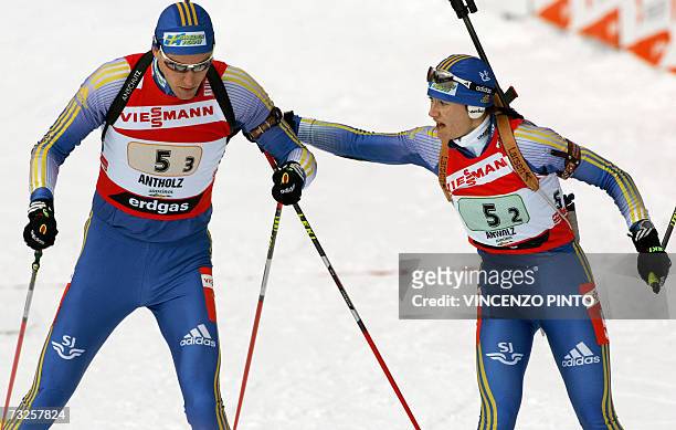 Sweden's Anna Carin Olofsson sends off teammate Bjorn Ferry during the mixed 2 x 6 + 2 x 7.5 km relay of the Biathlon World Championship in...