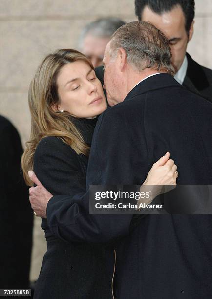 King Juan Carlos and Princess Letizia of Spain embrace during the funeral for Erika Ortiz, younger sister of Princess Letiza, on February 08, 2007 at...