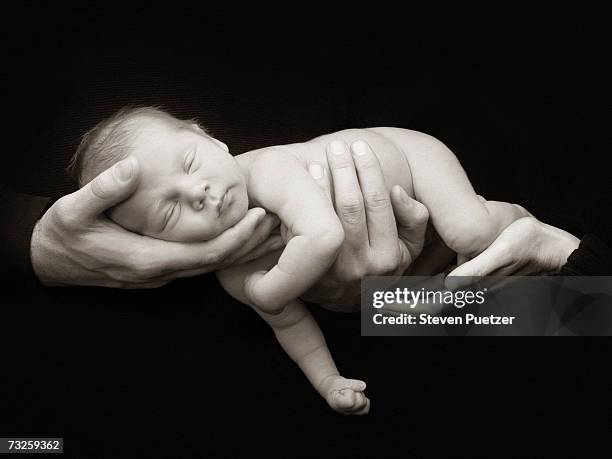 father holding baby (0-3 months) (b&w) - baby 3 months stock-fotos und bilder