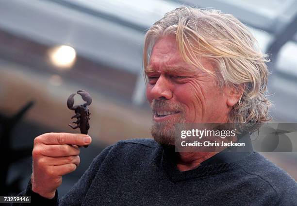 Richard Branson eats a scorpian at the launch of Virgin Media at Convent Garden Market on February 8, 2007 in London, England. Branson will spend the...