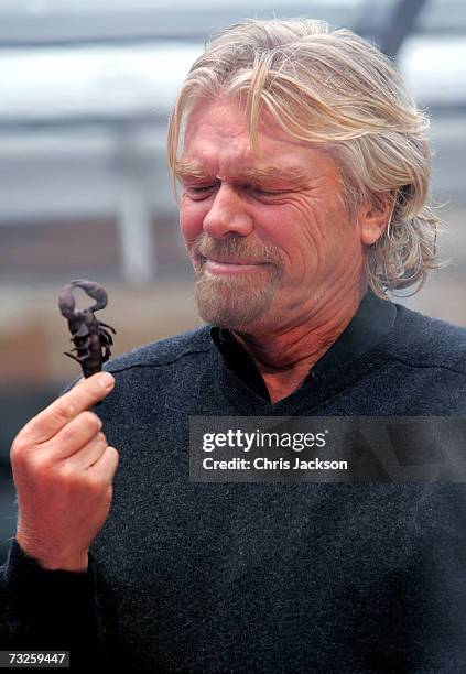 Richard Branson eats a scorpian at the launch of Virgin Media at Convent Garden Market on February 8, 2007 in London, England. Branson will spend the...