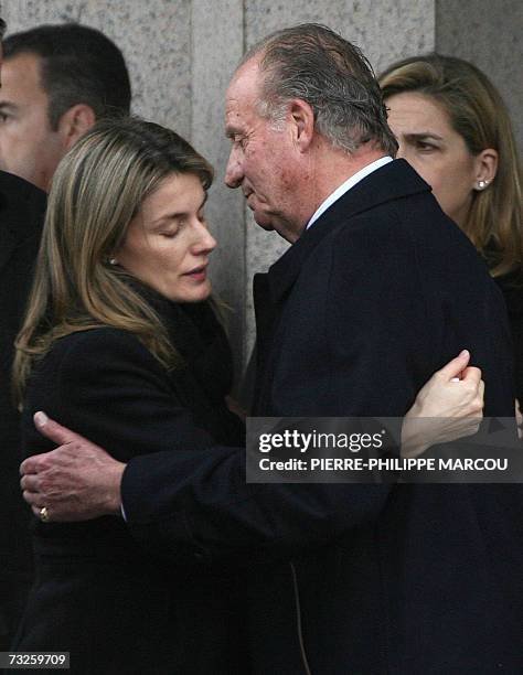 Spain's Princess Letizia is comforted by King Juan Carlos as they leave the crematorium of Tres Cantos near Madrid after the funeral of Erika Ortiz,...