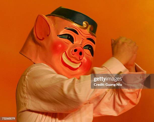 Man dressed as a pig performs during a gala to mark the upcoming Chinese New Year of the pig on February 8, 2007 in Beijing, China. The Chinese lunar...