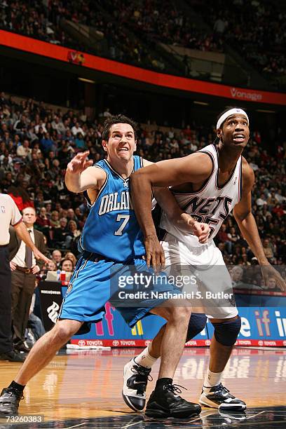 Redick of the Orlando Magic and Jason Collins of the New Jersey Nets battle for position on January 20, 2007 at the Continental Airlines Arena in...