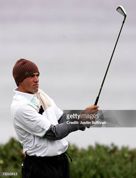 Surfer Kelly Slater tees off from the 4th tee of Spyglass Hill Golf Course during the first round of the AT&T Pebble Beach National Pro-Am February...