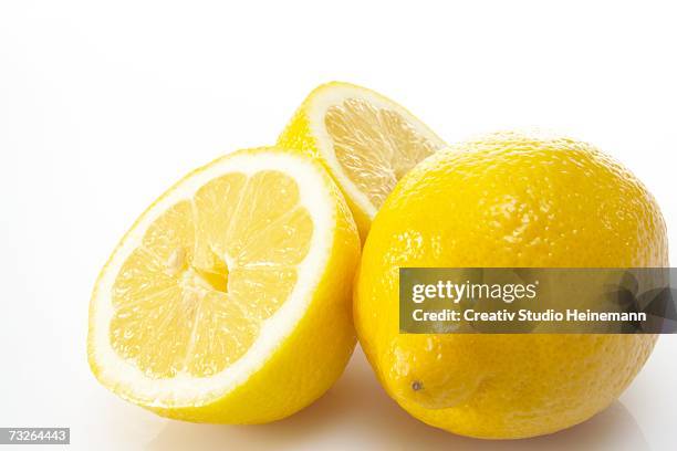 fresh lemons, close-up - lemons white background stock pictures, royalty-free photos & images