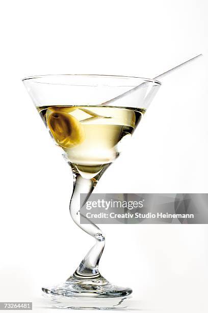 martini cocktail with olive, close-up - cocktail stick stock pictures, royalty-free photos & images