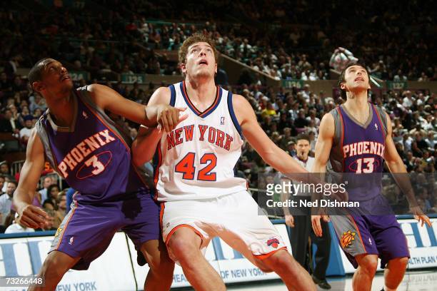 David Lee of the New York Knicks and Boris Diaw of the Phoenix Suns position for a rebound on January 24, 2007 at Madison Square Garden in New York...