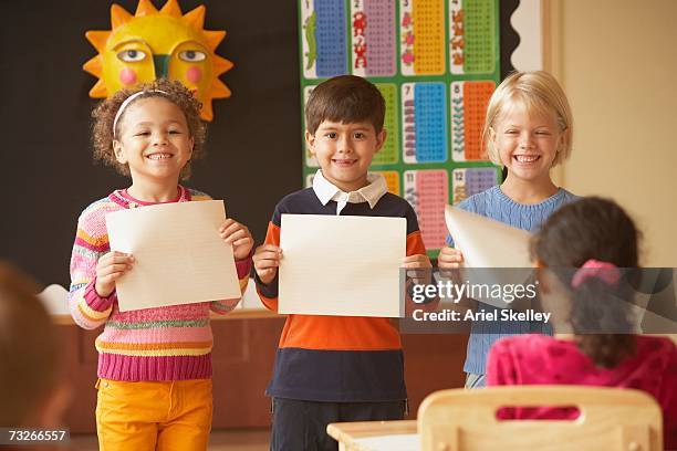 Students Using Paper Black Child Holding Paper Photos and Premium High Res Pictures - Getty ...