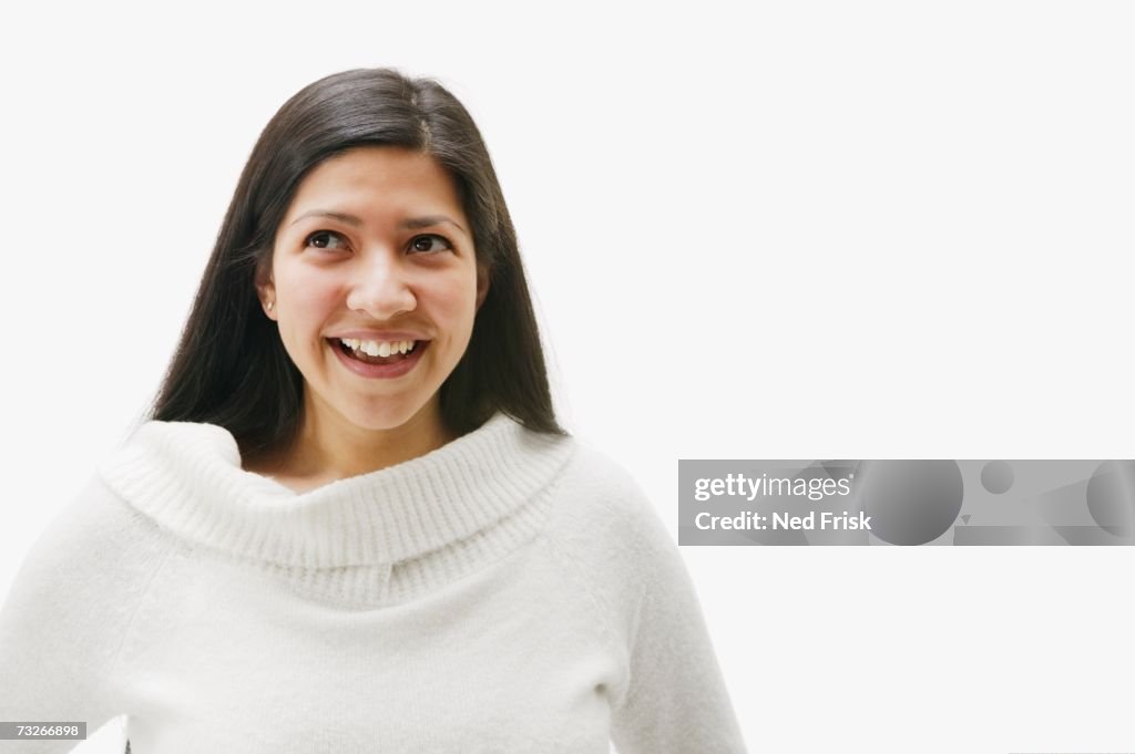 Studio shot of Hispanic woman smiling