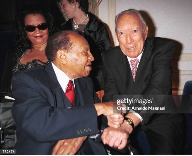 Actor Anthony Quinn greets Lionel Hampton during a roast party in Quinn's honor October 19, 2000 at the Palace Hotel in New York City. The event was...