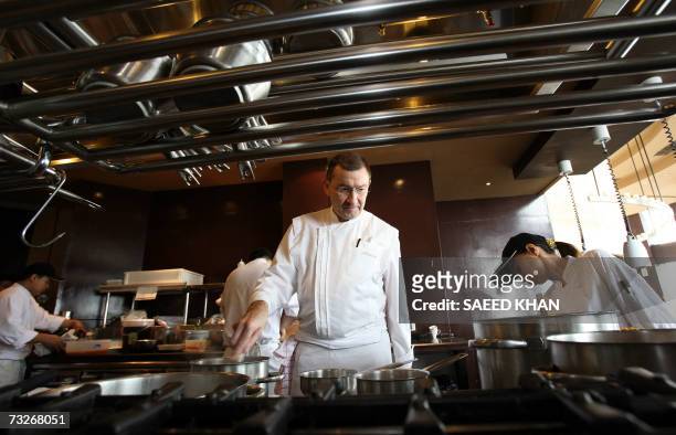Michelin three star chef Antoine Westerman from France prepares his specialities for lunch at the Mezzaluna resturant in Bangkok, 08 February 2006....