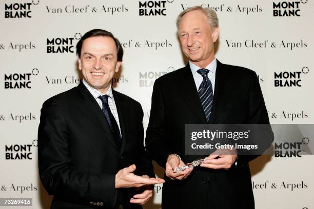 President and CEO of Van Cleef & Arples Europe Stanislas de Quercize and managing director of Montblanc Lutz Bethge pose while unveiling the...