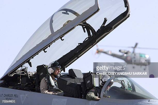 Indian tycoon and chairman of the Tata Group Ratan Tata sits in the co-pilot seat of a US made F-18 aircraft ahead of a flight during the third day...