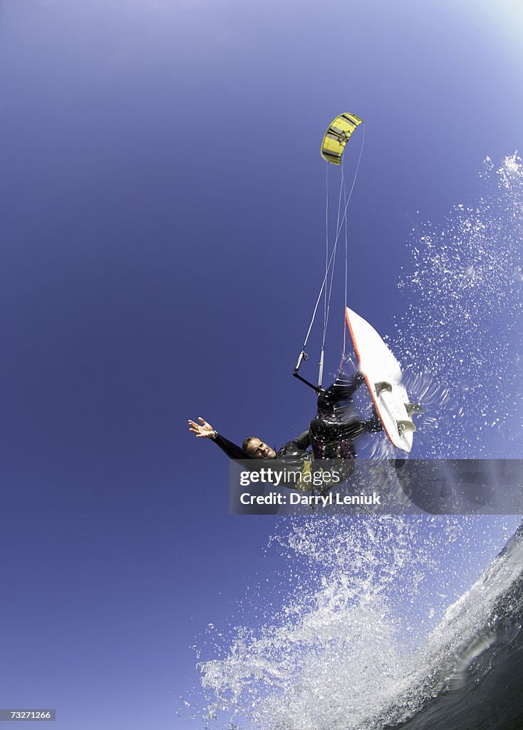 Man kiteboarding on sea