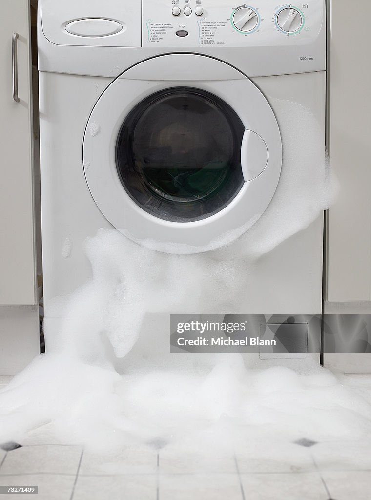 Washing machine overflowing, front view