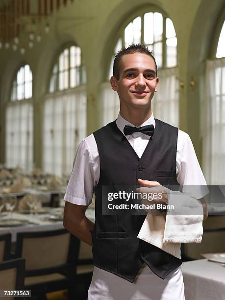 waiter with towel on his arm, portrait - servitör bildbanksfoton och bilder