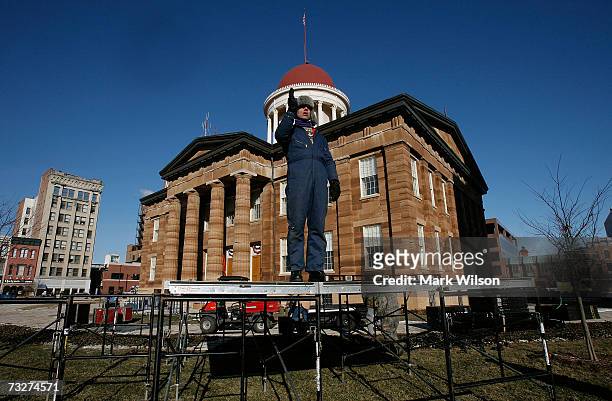 Brian Knox helps line up the stage that will be used in a rally in front door of the historic Illinois State Capitol building February 9, 2007 in...