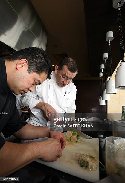 Michelin three star chef Antoine Westerman from France along with unidentified chef prepares lunch at the Mezzaluna resturant in Bangkok, 08 February...